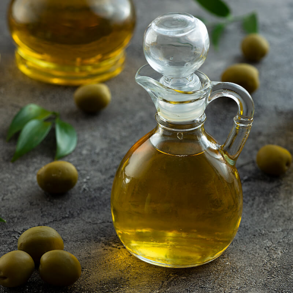 На фото изображено Масло оливковое Extra Virgin с лимоном, 0,25л